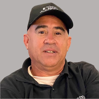 Man wearing a black cap and shirt.