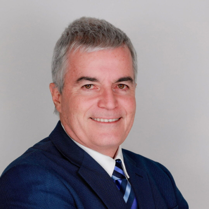 Smiling man in a blue suit.